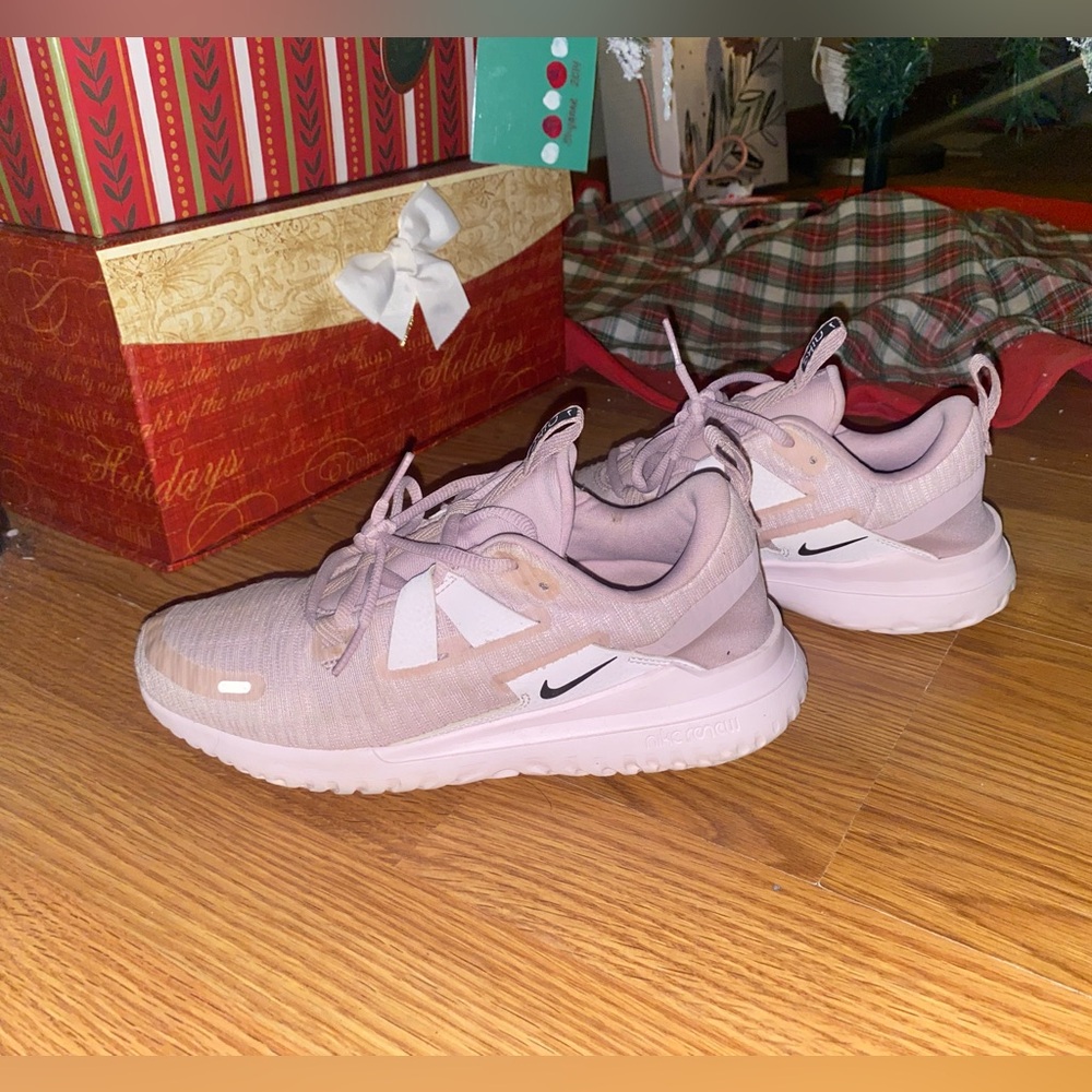 Pink Nike tennis shoes.